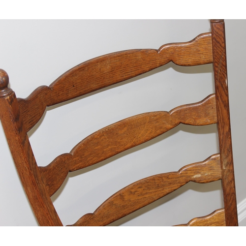 107 - A pair of unusual high ladder back oak chairs with green upholstered seats, approx 112cm tall