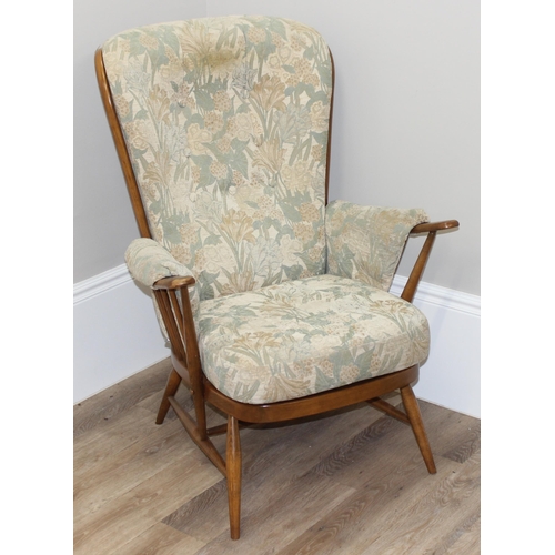 189 - Ercol floral print armchair with stick back, approx 76cm wide x 82cm deep x 108cm tall