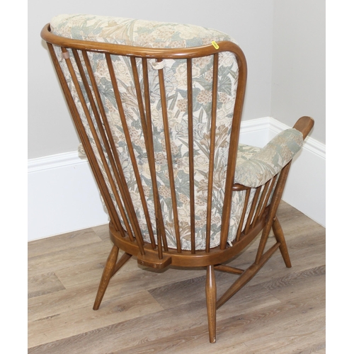 189 - Ercol floral print armchair with stick back, approx 76cm wide x 82cm deep x 108cm tall