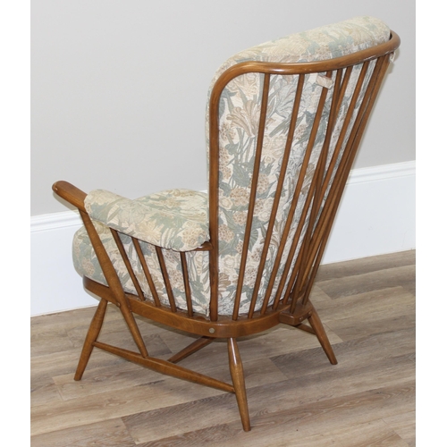 189 - Ercol floral print armchair with stick back, approx 76cm wide x 82cm deep x 108cm tall