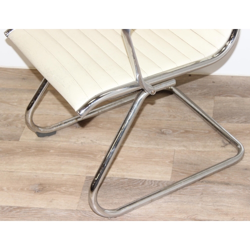 64 - A Charles Eames style chrome and white leather cantilever chair, approx 88cm tall