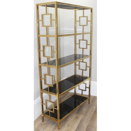 61 - An impressive gilt metal and smoked glass shelving unit or bookcase, approx 107cm wide x 38cm deep x... 