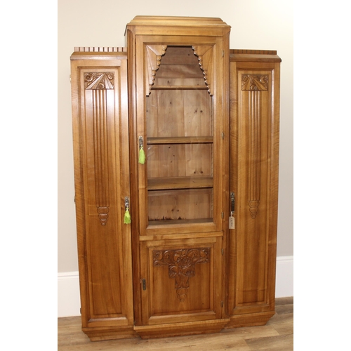 68 - An unusual Art Deco period hall or display cabinet believed to be satinwood with carved Deco motifs ... 