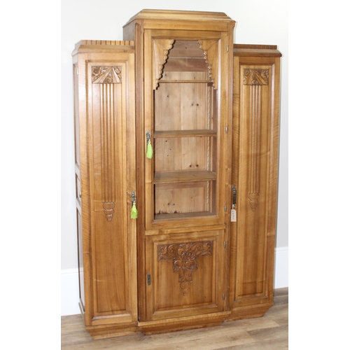 68 - An unusual Art Deco period hall or display cabinet believed to be satinwood with carved Deco motifs ... 