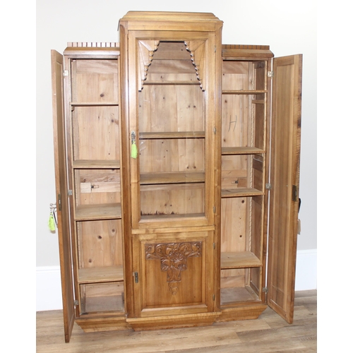 68 - An unusual Art Deco period hall or display cabinet believed to be satinwood with carved Deco motifs ... 