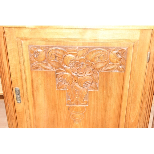 68 - An unusual Art Deco period hall or display cabinet believed to be satinwood with carved Deco motifs ... 