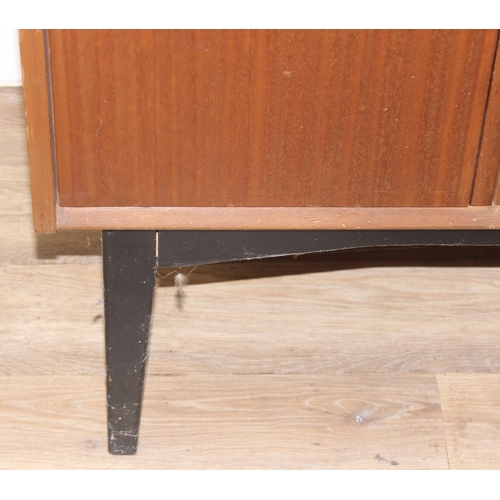 136 - A vintage sideboard with 3 drawers flanked by 2 cupboards, brass handles and ebonised legs, seemingl... 