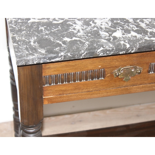 129 - An antique marble topped side table or wash stand with 2 drawers and brass handles, approx 107cm wid... 