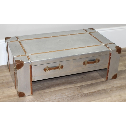 3 - An Aviator style aluminium coffee table with wooden straps and leather corners and handles, with 4 d... 