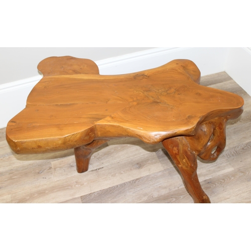 91 - A heavy interesting carved root wood coffee or side table, approx 110cm wide x 65cm deep x 62cm tall