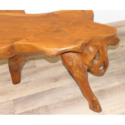 91 - A heavy interesting carved root wood coffee or side table, approx 110cm wide x 65cm deep x 62cm tall