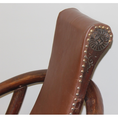 93 - An unusual Chinese Hangzhou style folding hard wood and leather chair with horseshoe back and carved... 