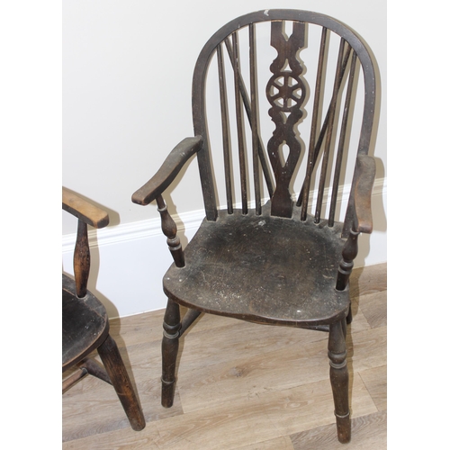 172 - 2 vintage farmhouse armchairs, a bow chair with oak seat and a vintage wheelback with elm seat (2)