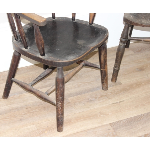 172 - 2 vintage farmhouse armchairs, a bow chair with oak seat and a vintage wheelback with elm seat (2)