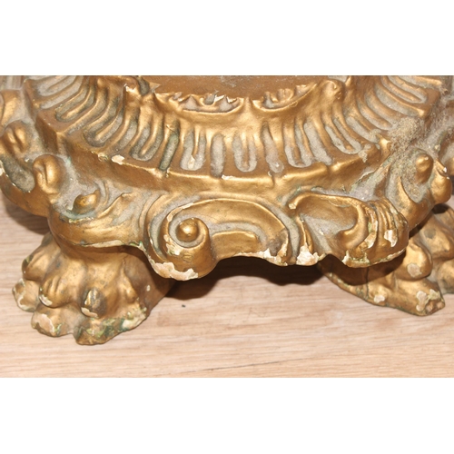 116 - An impressive gilt wood and gesso console table with lion paw feet and cherub support, coloured marb... 