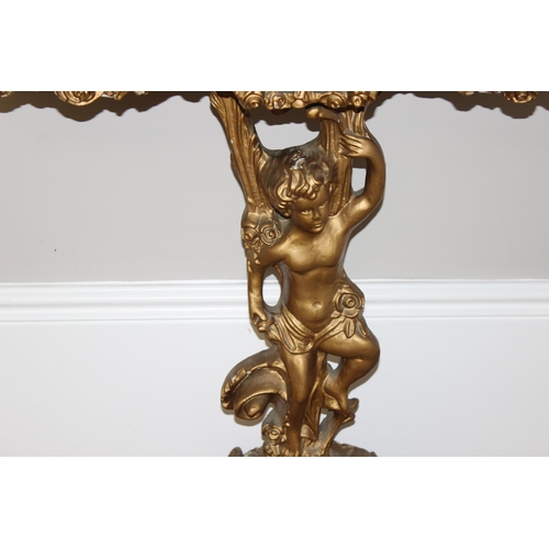 116 - An impressive gilt wood and gesso console table with lion paw feet and cherub support, coloured marb... 