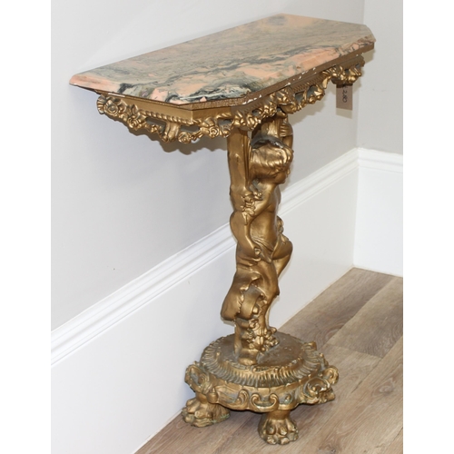 116 - An impressive gilt wood and gesso console table with lion paw feet and cherub support, coloured marb... 