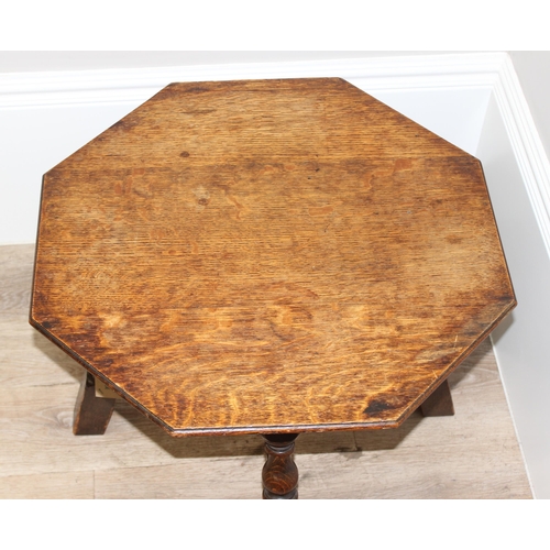 85 - An early 20th century octagonal topped oak low table, approx 56cm wide x 56cm deep x 41cm tall