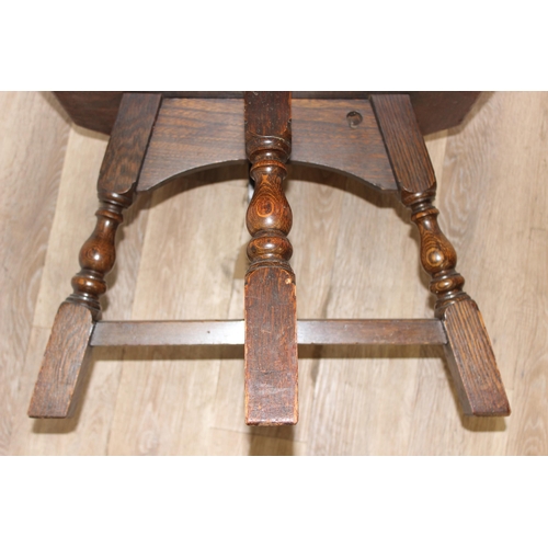 85 - An early 20th century octagonal topped oak low table, approx 56cm wide x 56cm deep x 41cm tall