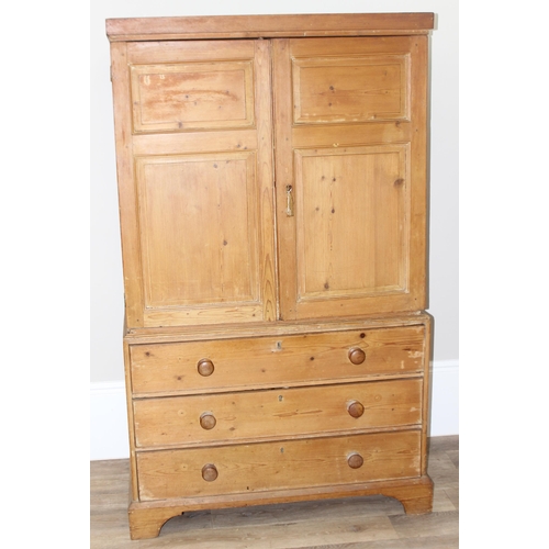 84 - A Victorian pine linen press on 3 drawer chest of drawers base, the base with bracket feet and turne... 