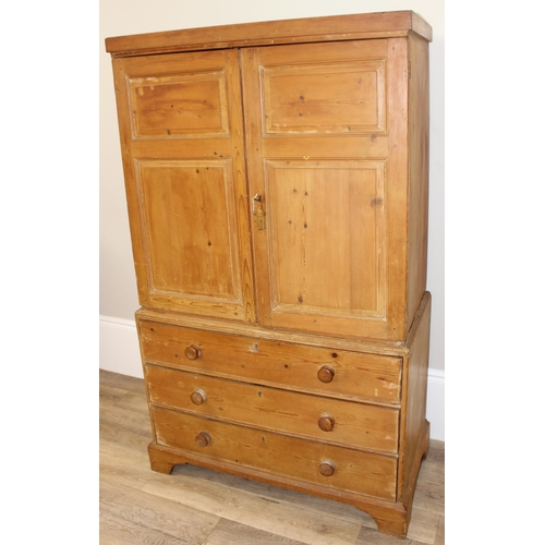 84 - A Victorian pine linen press on 3 drawer chest of drawers base, the base with bracket feet and turne... 