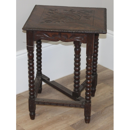 83 - An unusual Jacobean style oak drop leaf table of small proportions with carved top and bobbin turned... 