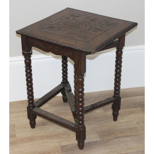 83 - An unusual Jacobean style oak drop leaf table of small proportions with carved top and bobbin turned... 