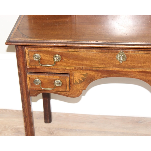 120 - A 19th century ladies writing or work desk with Sheraton inlay and fretwork details, a central stati... 