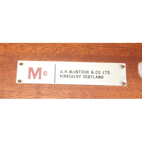 77 - A.H. McIntosh & Co of Kirkcaldy, a retro nest of 3 tables, the largest approx 53cm wide x 36cm deep ... 