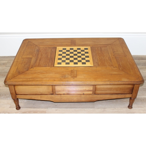 160 - A Christian Roberts Furniture low coffee table, the centre with removeable wine bottle holder and dr... 