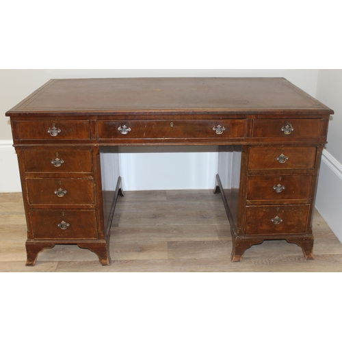 97 - Vintage mahogany twin pedestal desk with burgundy leather top, approx 135cm W x 73cm D x 74cm H