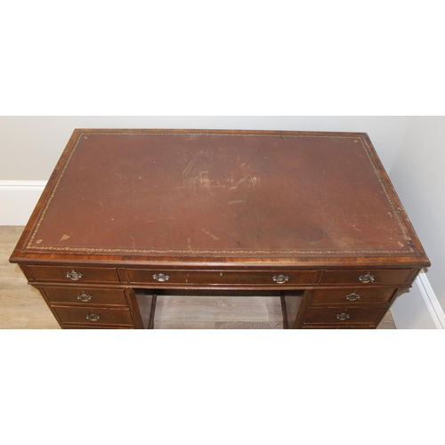 97 - Vintage mahogany twin pedestal desk with burgundy leather top, approx 135cm W x 73cm D x 74cm H