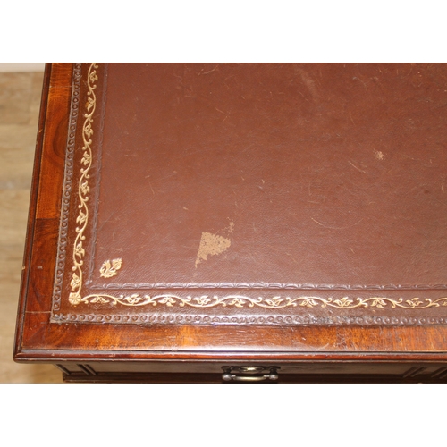 97 - Vintage mahogany twin pedestal desk with burgundy leather top, approx 135cm W x 73cm D x 74cm H