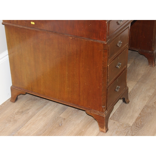 97 - Vintage mahogany twin pedestal desk with burgundy leather top, approx 135cm W x 73cm D x 74cm H