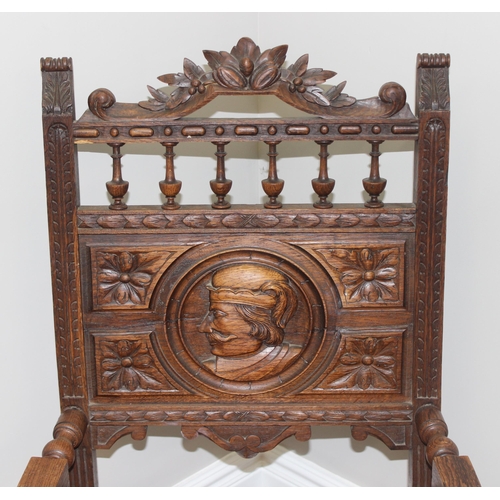 178 - Solid carved oak Wainscot style armchair with carved back panel depicting a male in profile, likely ... 