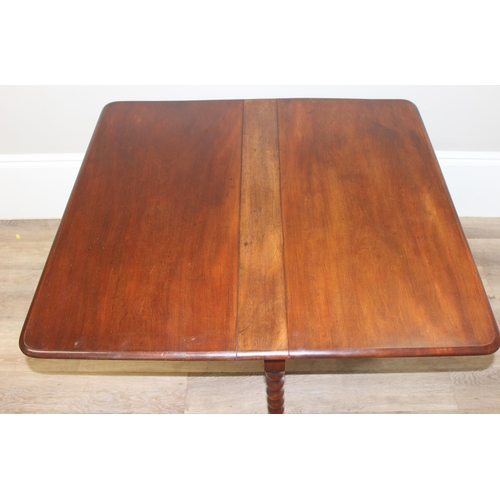 134 - Victorian Mahogany drop leaf Sutherland table with bobbin turned legs and cross supports, approx 90c... 