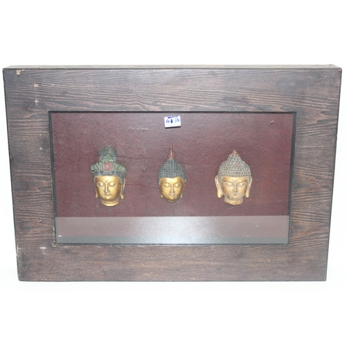 585 - A set of 3 buddha heads in boxed display frame, approx 80cm x 55cm