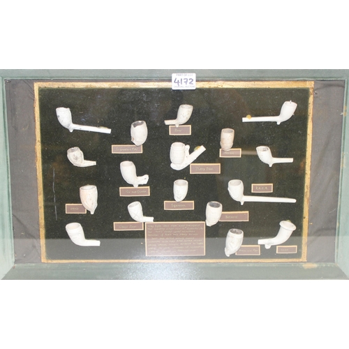 586 - An unusual box framed display of various antique clay pipes with annotations, approx 64cm x 40cm