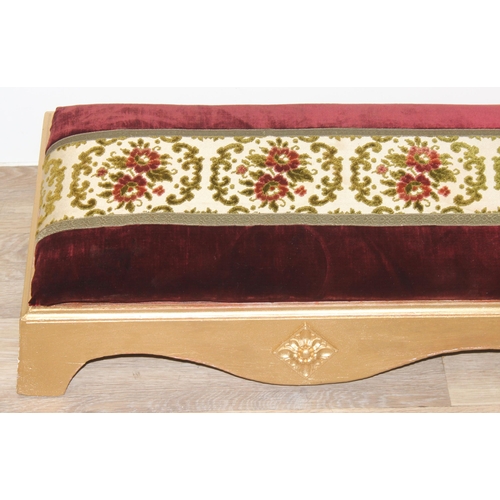 114 - A long gold painted and upholstered low foot stool, approx 122cm wide x 30cm deep x 20cm tall