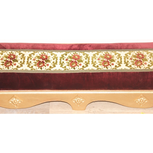 114 - A long gold painted and upholstered low foot stool, approx 122cm wide x 30cm deep x 20cm tall