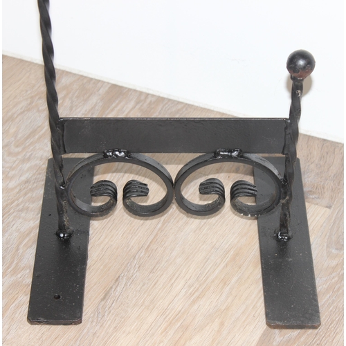 389 - A black painted wrought iron boot scraper, approx 85cm tall