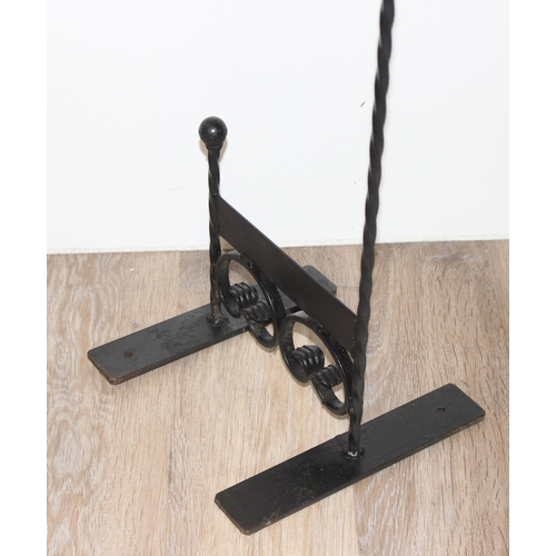 389 - A black painted wrought iron boot scraper, approx 85cm tall