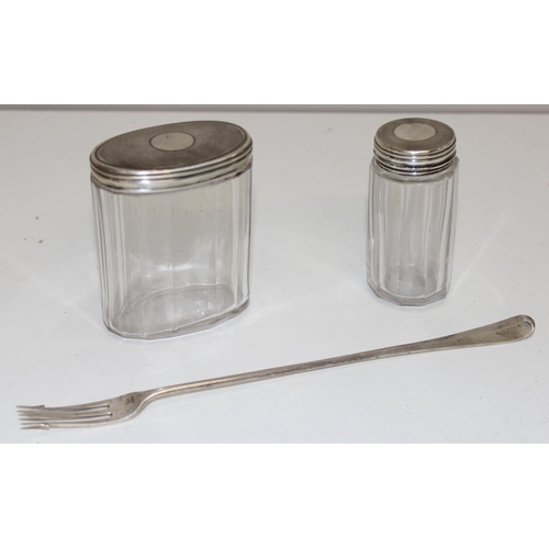 1035 - 2 silver topped jars with cut glass bases, London 1875 and a long silver pickle fork, London 1898, a... 