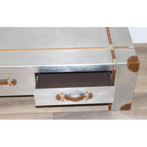 3 - An Aviator style aluminium coffee table with wooden straps and leather corners and handles, with 4 d... 