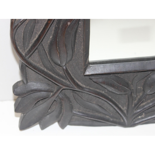 628 - Art Nouveau style carved wooden mirror, approx 36cm x 30cm