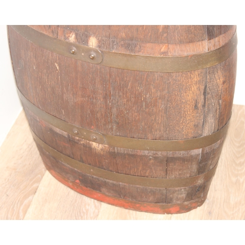 164 - A vintage coopered oak barrel of oval form, likely a stick stand, approx 63cm tall x 39cm wide