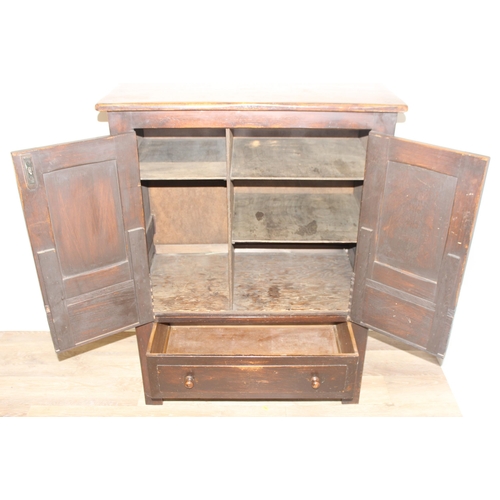 159 - An antique style oak 2 door and 2 drawer side cabinet with shaped iron hinges, approx 81cm wide x 46... 