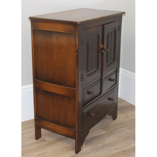 159 - An antique style oak 2 door and 2 drawer side cabinet with shaped iron hinges, approx 81cm wide x 46... 