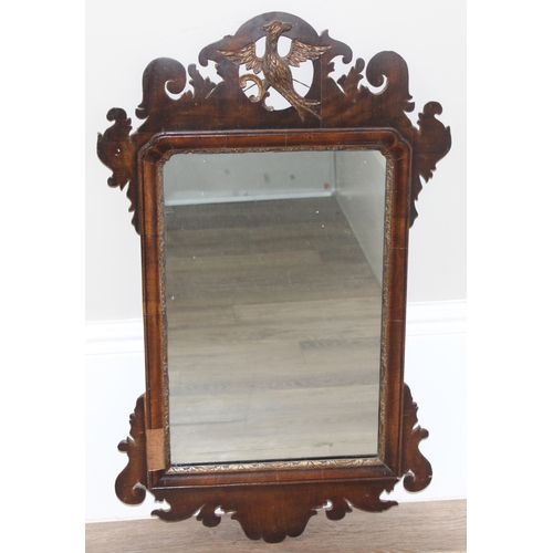 626 - A Georgian mahogany framed fretwork mirror with carved eagle design, approx 82cm x 50cm