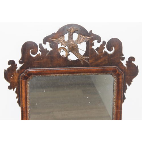 626 - A Georgian mahogany framed fretwork mirror with carved eagle design, approx 82cm x 50cm